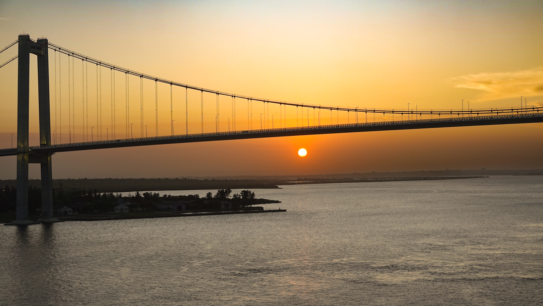 sunset over bridge feature